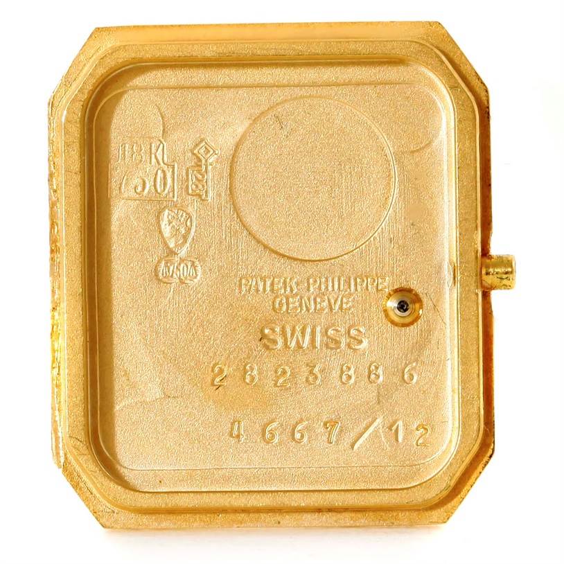 This image shows the case back interior of a Patek Philippe 4667 Women's Yellow Gold Beige Dial 4667 Women's Yellow Gold Beige Dial 4667 model 18k Yellow Gold Diamond Emerald Ladies Watch.
