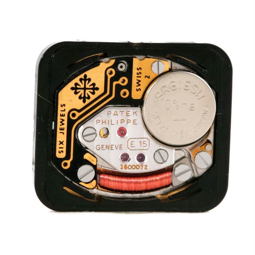 This image shows the internal movement component of a Patek Philippe 4667 Women's Yellow Gold Beige Dial 4667 Women's Yellow Gold Beige Dial 4667 18k Yellow Gold Diamond Emerald Ladies Watch.