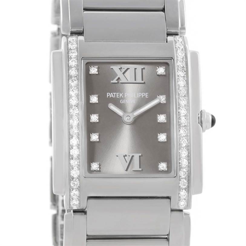 The image shows a front view of the Patek Philippe Twenty-4 4910/10A-010 Women's Stainless Steel Grey Dial 4910/10A-010 Women's Stainless Steel Grey Dial watch, highlighting its face, bracelet, and diamond accents.