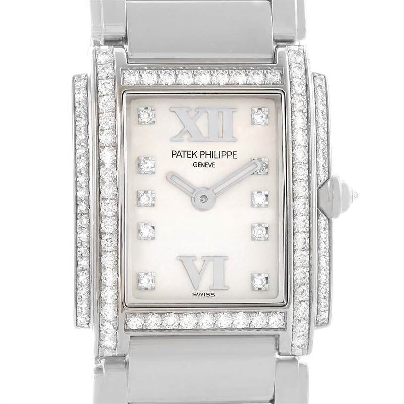 The image shows a close-up, front view of the Patek Philippe Twenty-4 4908/200G-011 Women's White Gold Silver Dial 4908/200G-011 Women's White Gold Silver Dial watch face with diamond accents and Roman numerals.
