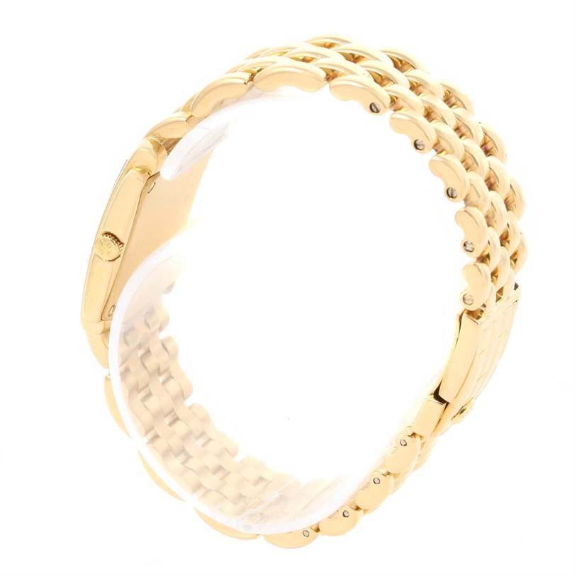 The image shows a side view of the gold bracelet and case of a Patek Philippe Gondolo 4824 Women's Yellow Gold White Dial 4824 Women's Yellow Gold White Dial watch.