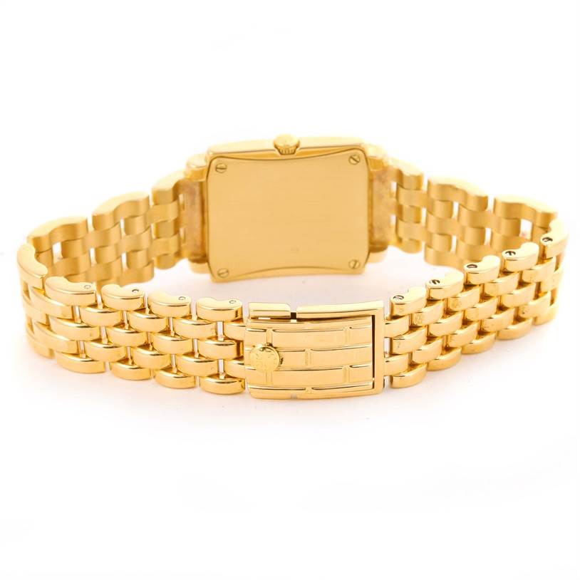 The image shows the back and bracelet of the Patek Philippe Gondolo 4824 Women's Yellow Gold White Dial 4824 Women's Yellow Gold White Dial watch, highlighting its gold finish and clasp.