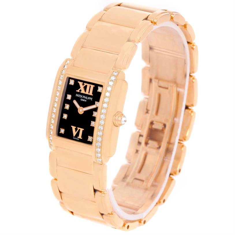 The image shows a Patek Philippe Twenty-4 4908/11R Women's Rose Gold Black Dial 4908/11R Women's Rose Gold Black Dial watch angled to display its face, bracelet, and crown.