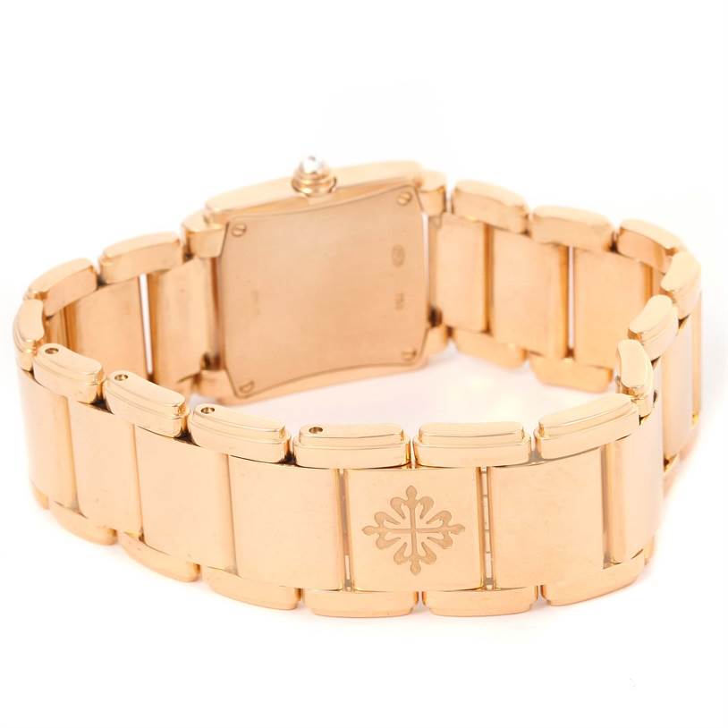 The image shows the back of the Patek Philippe Twenty-4 4908/11R Women's Rose Gold Black Dial 4908/11R Women's Rose Gold Black Dial watch, highlighting the bracelet clasp and logo.