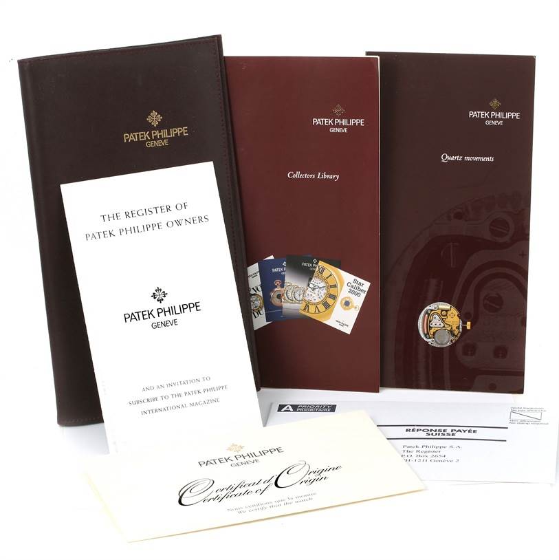The image shows documentation and booklets for the Twenty-4 model by Patek Philippe from a front angle.