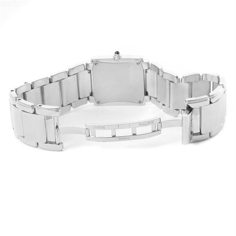 The image shows the back view of a Patek Philippe Twenty-4 4910/10A-010 Women's Stainless Steel Grey Dial 4910/10A-010 Women's Stainless Steel Grey Dial watch with a focus on its open stainless steel bracelet and clasp.