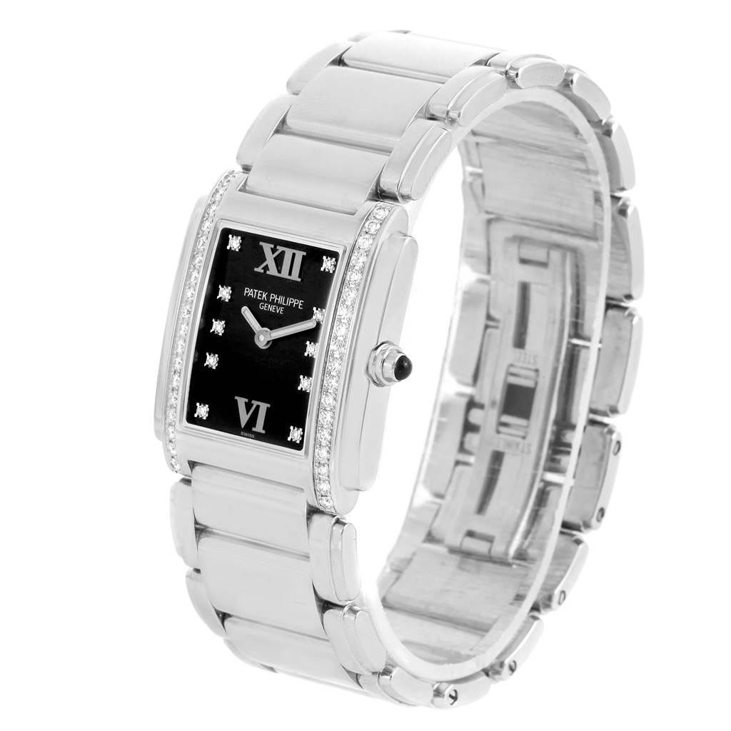 The image shows a side and front view of the Patek Philippe Twenty-4 4910/10A-001 Women's Stainless Steel Black Dial 4910/10A-001 Women's Stainless Steel Black Dial watch, highlighting its bracelet and black dial with diamond accents.