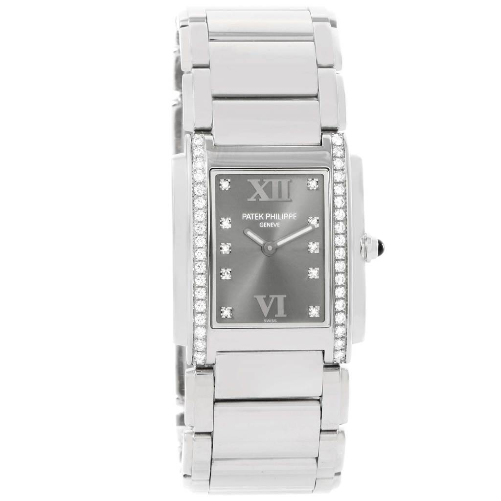 The image shows a frontal view of the Patek Philippe Twenty-4 4910/10A-010 Women's Stainless Steel Grey Dial 4910/10A-010 Women's Stainless Steel Grey Dial watch, displaying its face, bracelet, and side details.