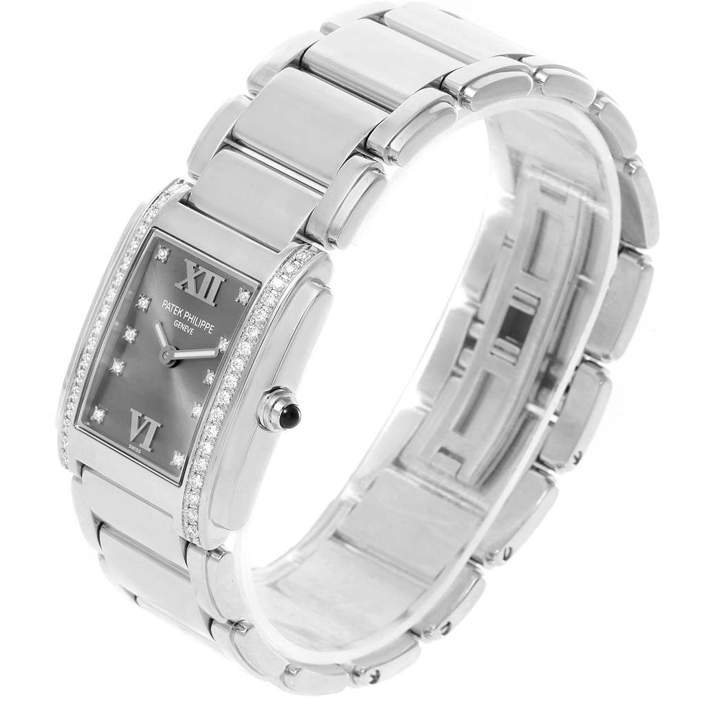 The image shows a side angle of the Patek Philippe Twenty-4 4910/10A-010 Women's Stainless Steel Grey Dial 4910/10A-010 Women's Stainless Steel Grey Dial model, highlighting the watch face, bezel, and band.