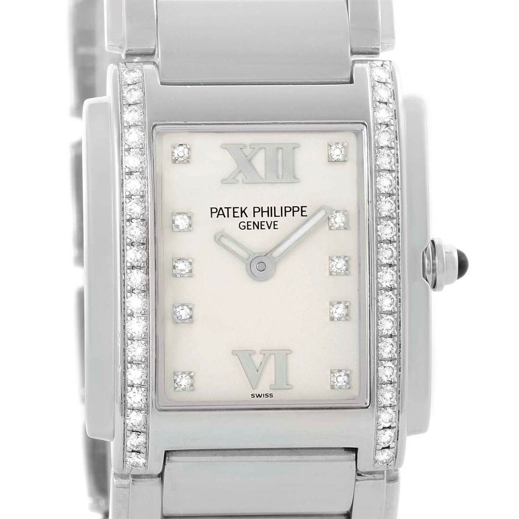 The image shows a close-up, front view of the Patek Philippe Twenty-4 4910 Women's Stainless Steel Silver Dial 4910 Women's Stainless Steel Silver Dial model watch, highlighting its face and surrounding diamond accents.