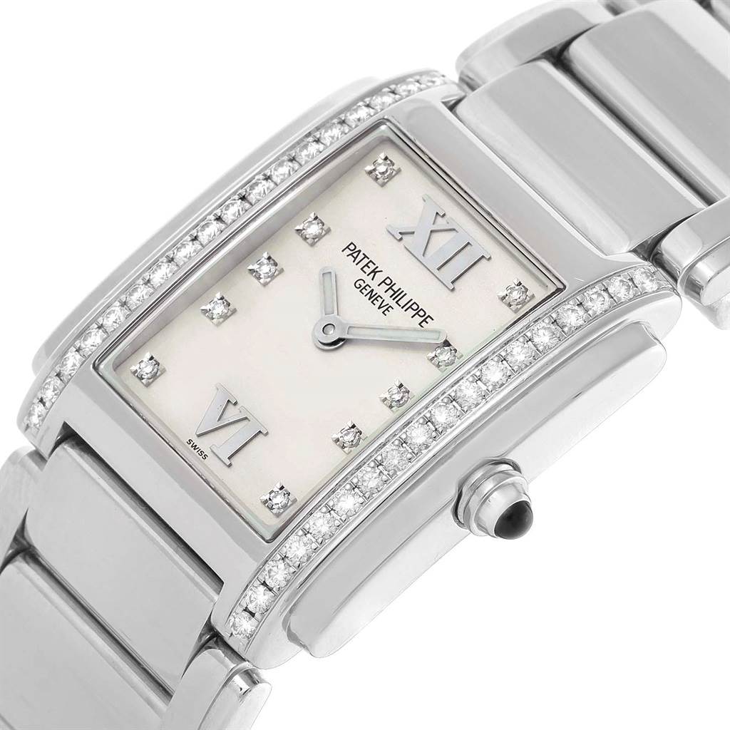 The image shows a close-up angle of the Patek Philippe Twenty-4 4910 Women's Stainless Steel Silver Dial 4910 Women's Stainless Steel Silver Dial watch, highlighting its diamond bezel and rectangular dial.