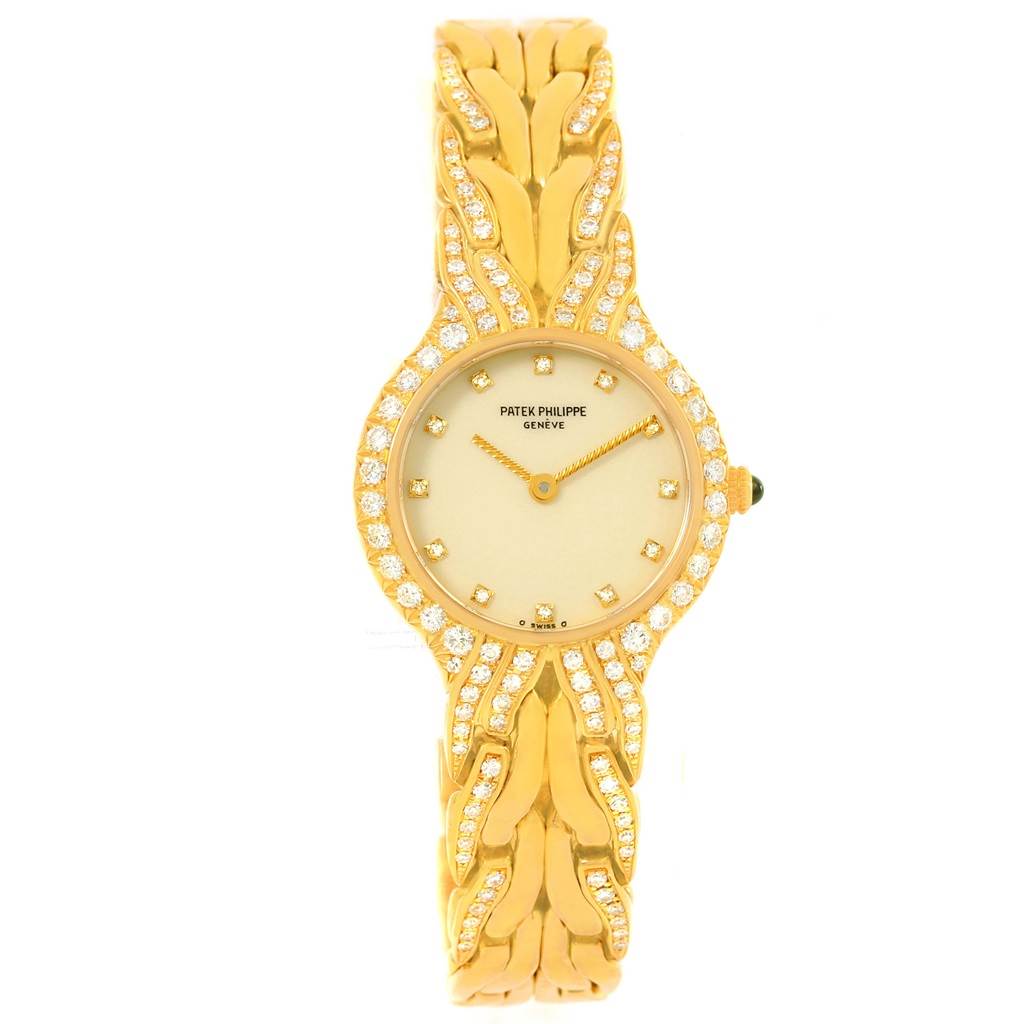 This image shows a front view of the Patek Philippe La Flamme  4816 Women's Yellow Gold Beige Dial 4816 Women's Yellow Gold Beige Dialwatch, displaying its face and bracelet adorned with diamonds.