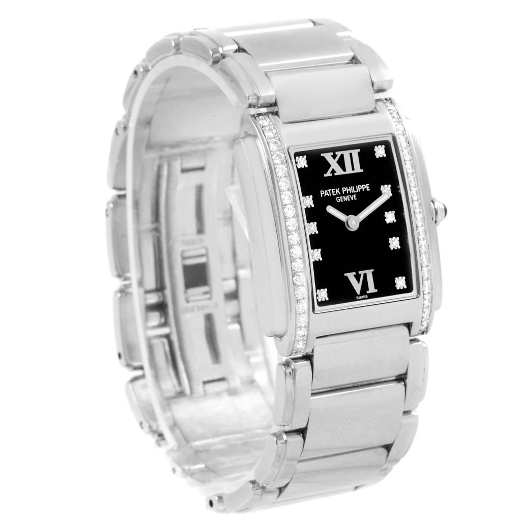 The image shows a Patek Philippe Twenty-4 4910-10A-001 Women
s Stainless Steel Black Dial 4910-10A-001 Women
s Stainless Steel Black Dial model watch, viewed from a three-quarter angle, highlighting its face, bracelet, and bezel.
