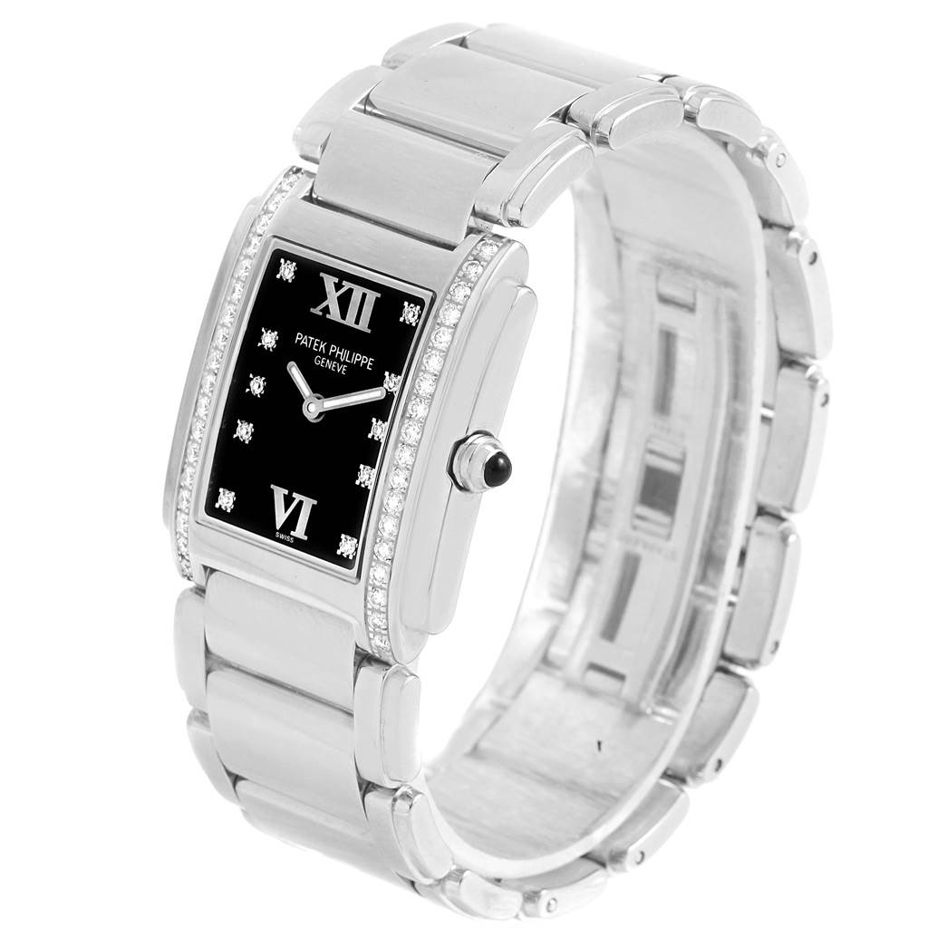 This image shows a Patek Philippe Twenty-4 4910-10A-001 Women
s Stainless Steel Black Dial 4910-10A-001 Women
s Stainless Steel Black Dial watch at a slight angle, displaying the face, bezel, and stainless steel bracelet.