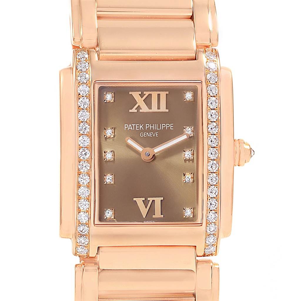 The image shows a frontal view of the Patek Philippe Twenty-4 4910/11R Women's Rose Gold Brown Dial 4910/11R Women's Rose Gold Brown Dial watch, highlighting its rectangular face, diamond accents, and bracelet.