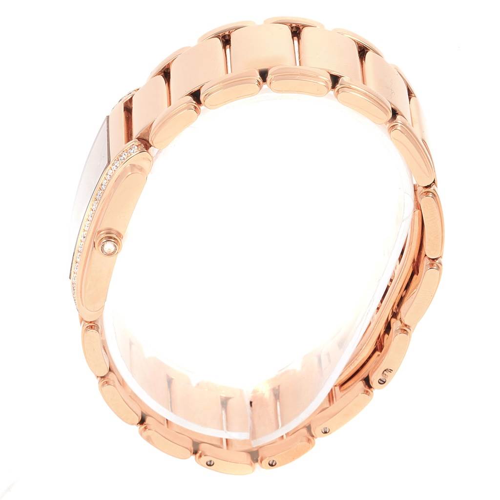 The image shows a side view of the rose gold bracelet and case of a Patek Philippe Twenty-4 4910/11R Women's Rose Gold Brown Dial 4910/11R Women's Rose Gold Brown Dial watch.