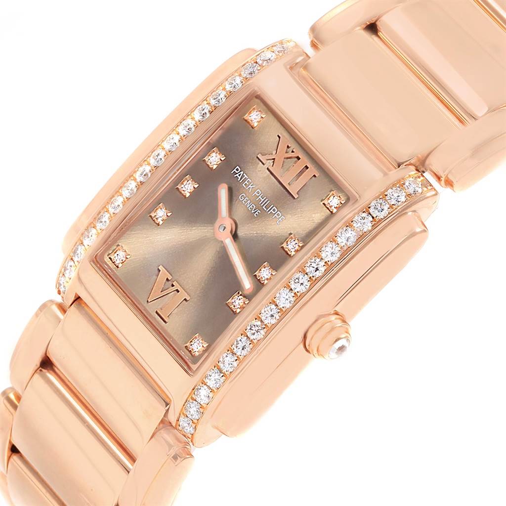 The image shows a close-up angled view of the Patek Philippe Twenty-4 4910/11R Women's Rose Gold Brown Dial 4910/11R Women's Rose Gold Brown Dial watch, highlighting the diamond-encrusted bezel and Roman numeral dial.