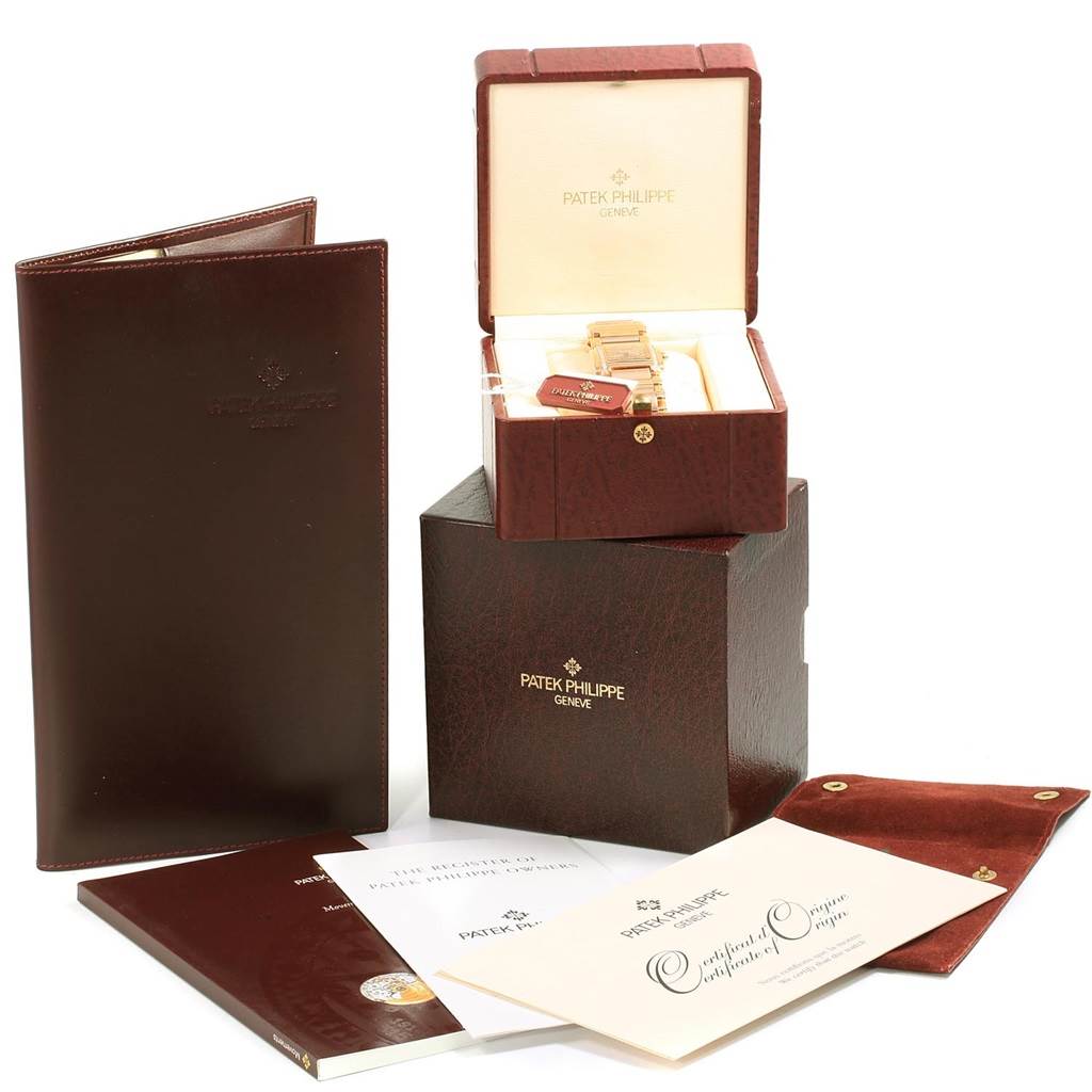 The image shows a Patek Philippe Twenty-4 4910/11R Women's Rose Gold Brown Dial 4910/11R Women's Rose Gold Brown Dial watch in an open box with accessories like a certificate, manual, and leather case.