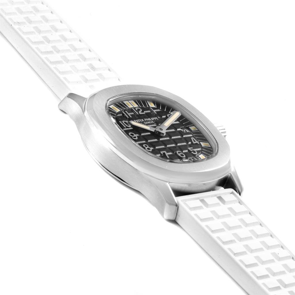 The image shows a side angle view of a Patek Philippe Aquanaut 4960 Women's Stainless Steel Black Dial 4960 Women's Stainless Steel Black Dial watch, highlighting the dial, case, and white strap.