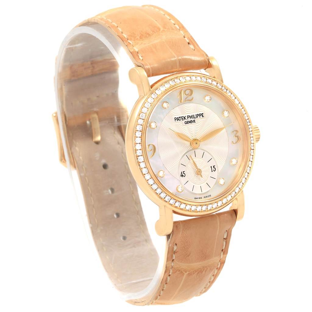 This image shows a Patek Philippe Calatrava 4959J Women's Mother of Pearl Dial 4959J Women's Mother of Pearl Dial watch at a 3/4 angle, highlighting its leather strap, bezel, and dial.