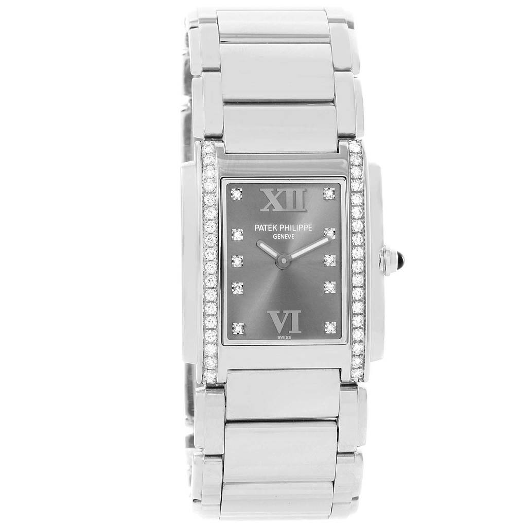 This image shows a front view of the Patek Philippe Twenty-4 4910/10A-010 Women's Stainless Steel Grey Dial 4910/10A-010 Women's Stainless Steel Grey Dial watch, highlighting its face, bezel with diamonds, and part of the bracelet.
