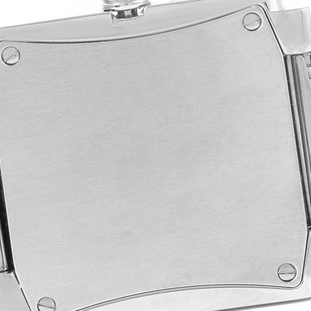 This image shows the back case of the Patek Philippe Twenty-4 4910 Women's Stainless Steel Silver Dial 4910 Women's Stainless Steel Silver Dial watch, focusing on its polished metal surface and screws.