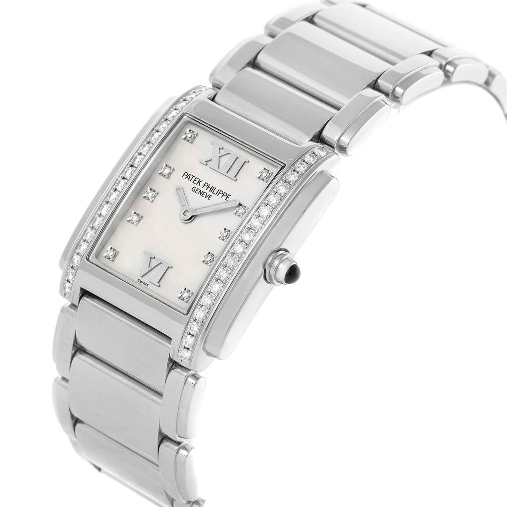 The image shows a Patek Philippe Twenty-4 4910 Women's Stainless Steel Silver Dial 4910 Women's Stainless Steel Silver Dial watch angled to showcase the face, bezel, and bracelet.