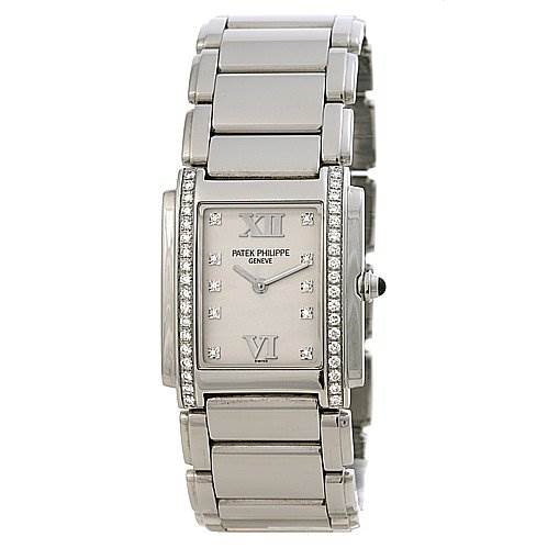The image shows a frontal view of a Patek Philippe Twenty-4 4910 /10A Women's Stainless Steel Silver Dial 4910 /10A Women's Stainless Steel Silver Dial model watch, showcasing its rectangular face and metal bracelet.