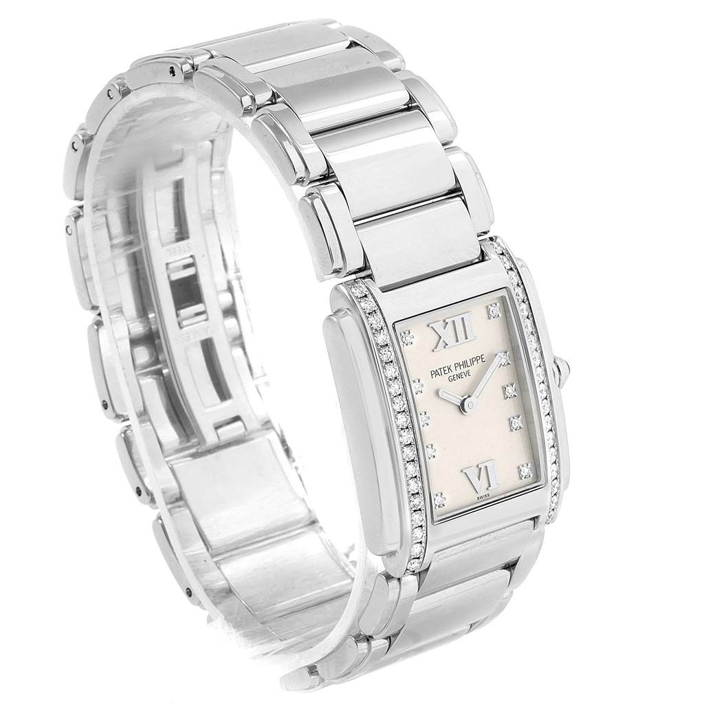 The image shows a Patek Philippe Twenty-4 4910 Women's Stainless Steel Silver Dial 4910 Women's Stainless Steel Silver Dial watch at a three-quarter angle, highlighting the bracelet and diamond-encrusted rectangular bezel.