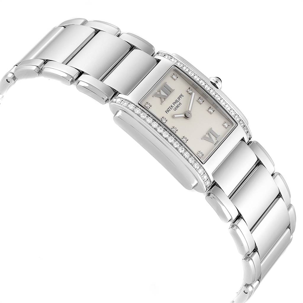 The image shows an angled view of the Patek Philippe Twenty-4 4910/10A-010 Women's Stainless Steel Silver Dial 4910/10A-010 Women's Stainless Steel Silver Dial watch, highlighting the dial, bracelet, and diamond accents.