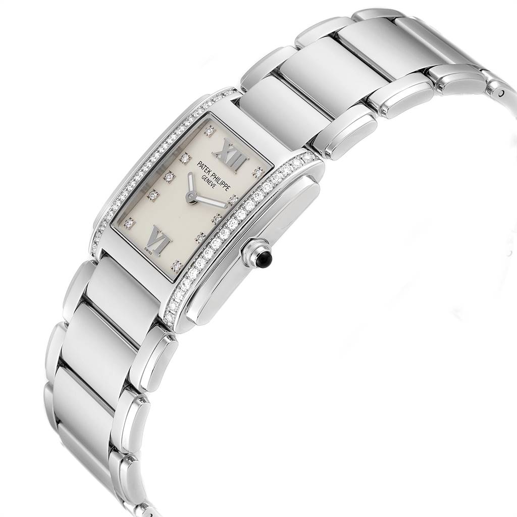 The image shows a side angle of the Patek Philippe Twenty-4 4910/10A-010 Women's Stainless Steel Silver Dial 4910/10A-010 Women's Stainless Steel Silver Dial model, highlighting the bracelet, dial, and crown.