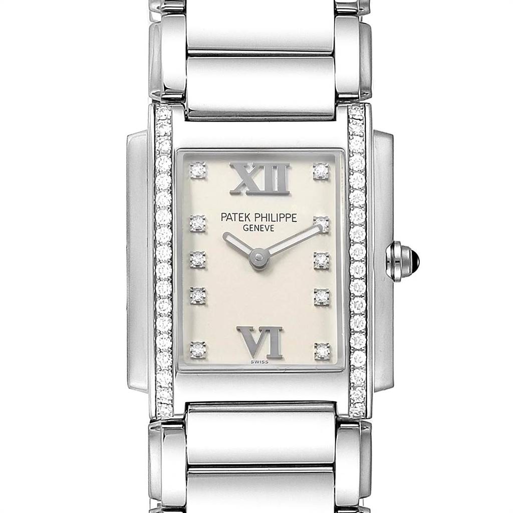 The image shows a front view of the Patek Philippe Twenty-4 4910/10A-010 Women's Stainless Steel Silver Dial 4910/10A-010 Women's Stainless Steel Silver Dial watch, highlighting its face, bracelet, and decorative diamonds.