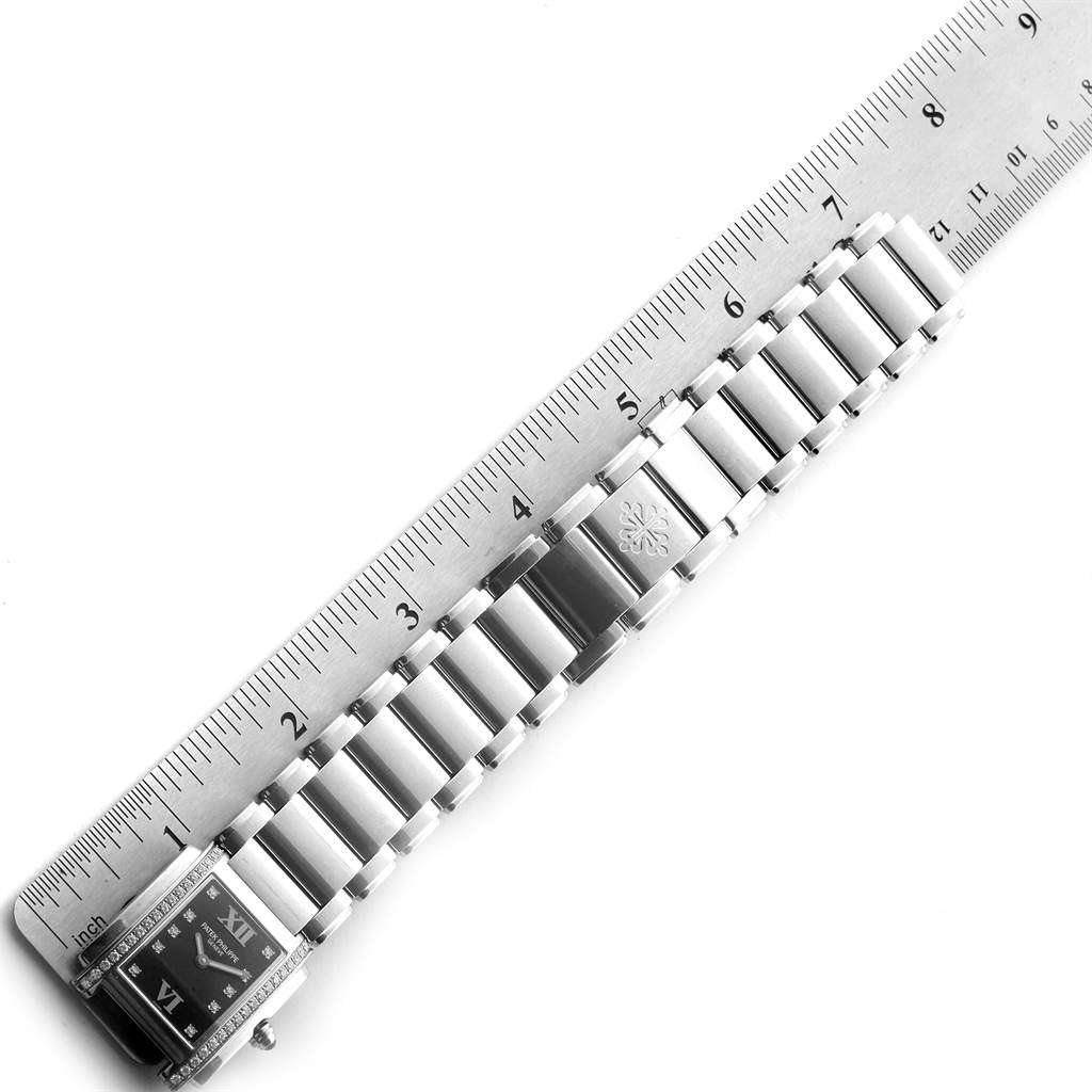 The image shows a Patek Philippe Twenty-4 4910-10A-001 Women's Stainless Steel Black Dial 4910-10A-001 Women's Stainless Steel Black Dial watch bracelet and links, measured against a ruler for size reference.