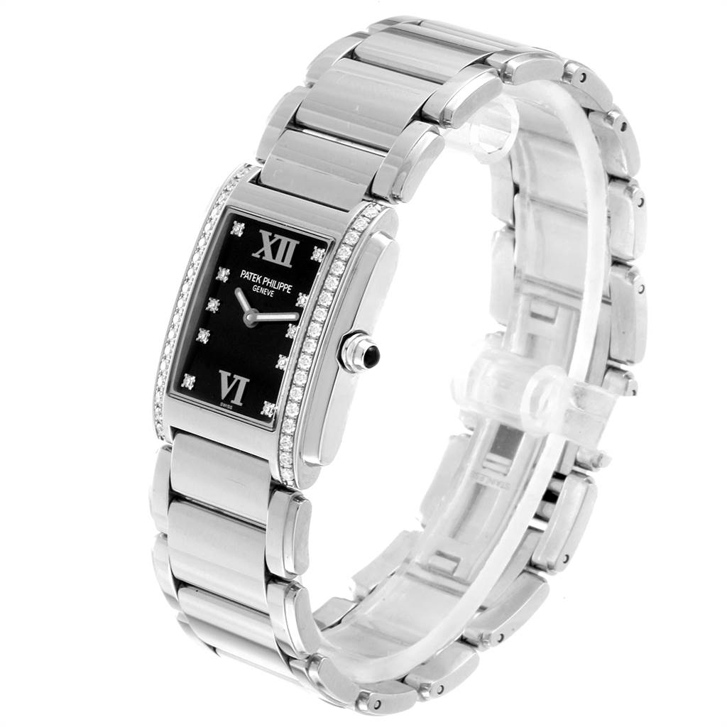 The Patek Philippe Twenty-4 4910-10A-001 Women's Stainless Steel Black Dial 4910-10A-001 Women's Stainless Steel Black Dial model is shown at a three-quarter angle, highlighting the bracelet, dial, and side crown.