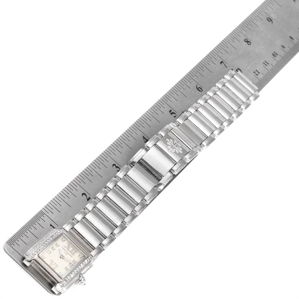 This shows an overhead view of the Patek Philippe Twenty-4 4908/200G-011 Women's White Gold Silver Dial 4908/200G-011 Women's White Gold Silver Dial watch with a ruler for scale comparison.