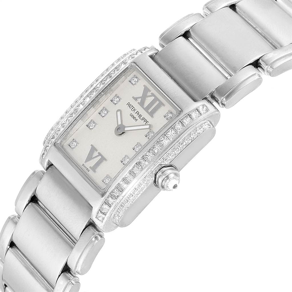 This image shows a close-up of a Patek Philippe Twenty-4 4908/200G-011 Women's White Gold Silver Dial 4908/200G-011 Women's White Gold Silver Dial model watch, highlighting its face, crown, and part of the bracelet.