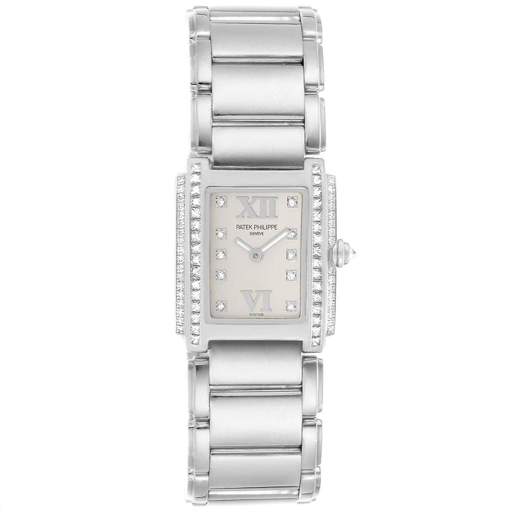 The image shows a front view of a Patek Philippe Twenty-4 4908/200G-011 Women's White Gold Silver Dial 4908/200G-011 Women's White Gold Silver Dial model watch, highlighting its rectangular dial, diamond bezel, and metal bracelet.