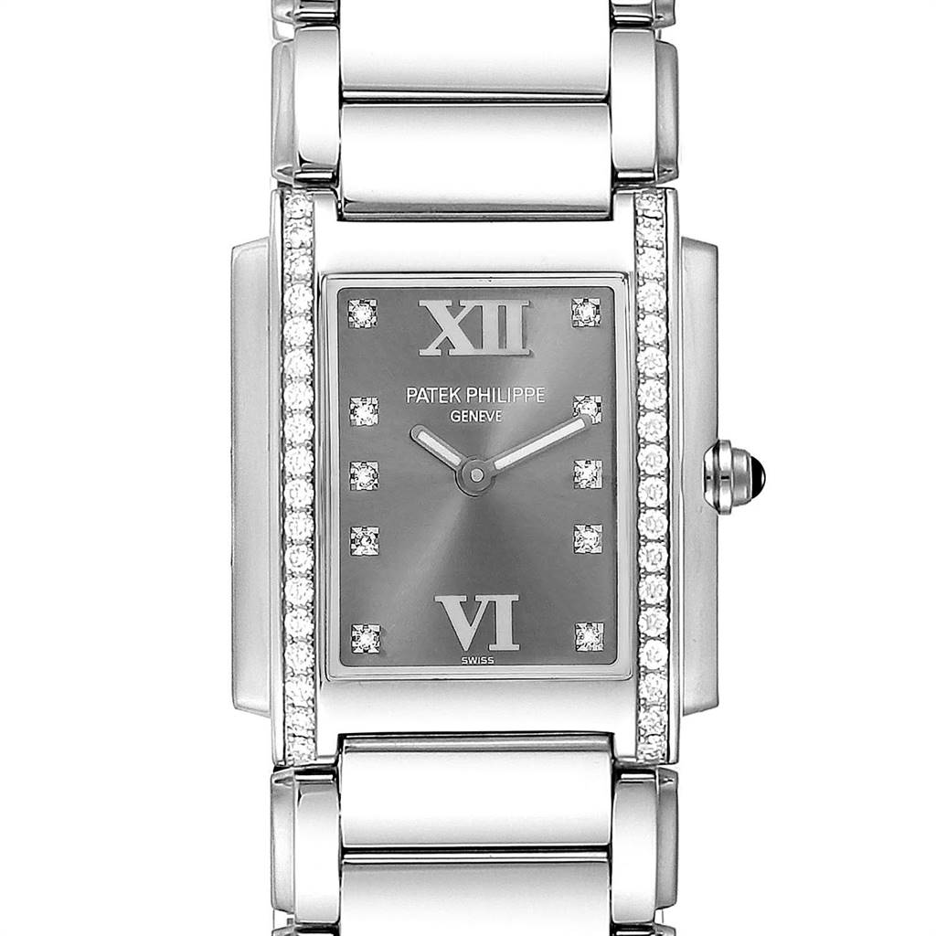 This image shows a front view of the Patek Philippe Twenty-4 4910/10A-010 Women's Stainless Steel Grey Dial 4910/10A-010 Women's Stainless Steel Grey Dial watch, highlighting its face, bezel with diamonds, and part of the bracelet.