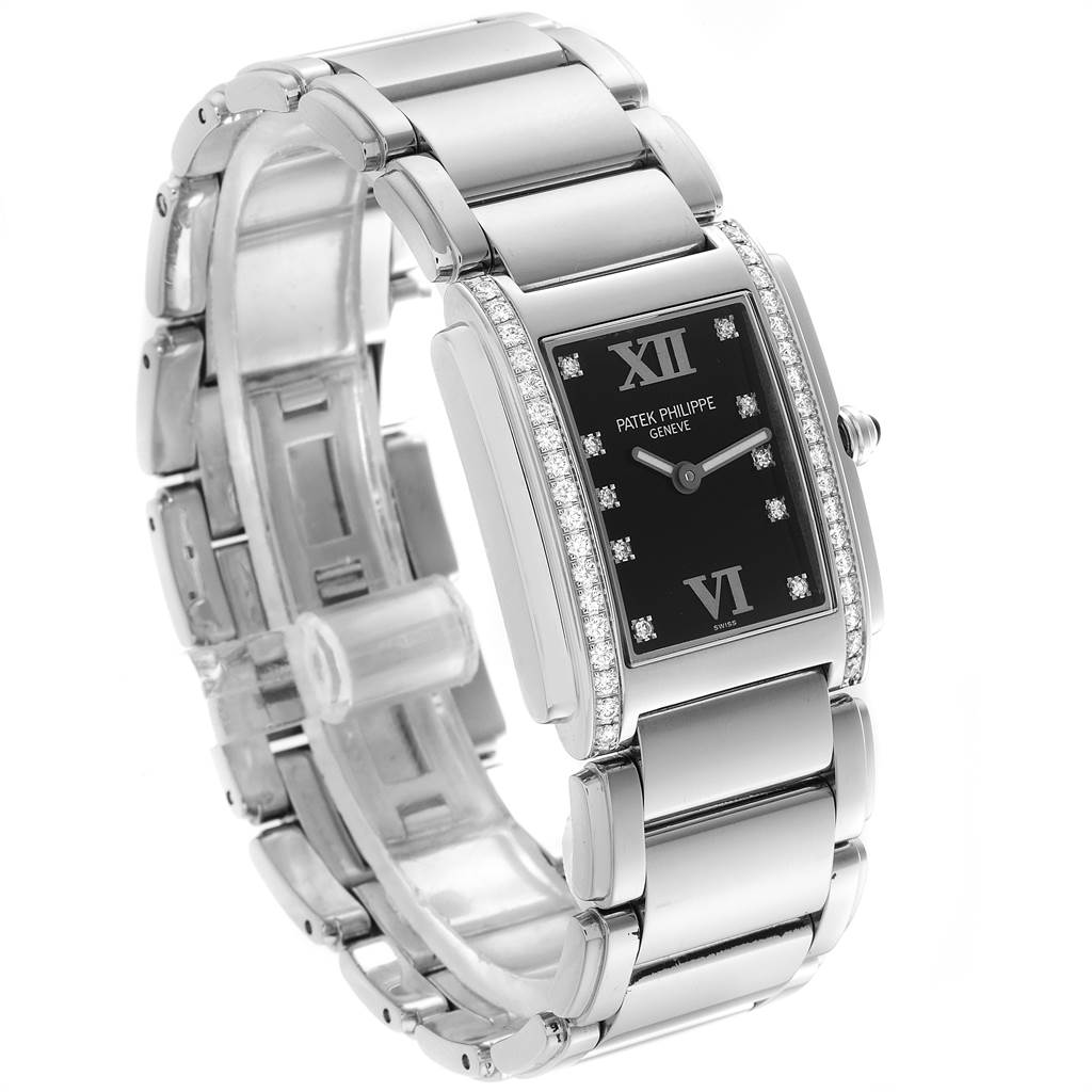 The Patek Philippe Twenty-4 4910-10A-001 Women's Stainless Steel Black Dial 4910-10A-001 Women's Stainless Steel Black Dial watch is shown from a front-right angle displaying the face, bracelet, and side profile with diamonds.