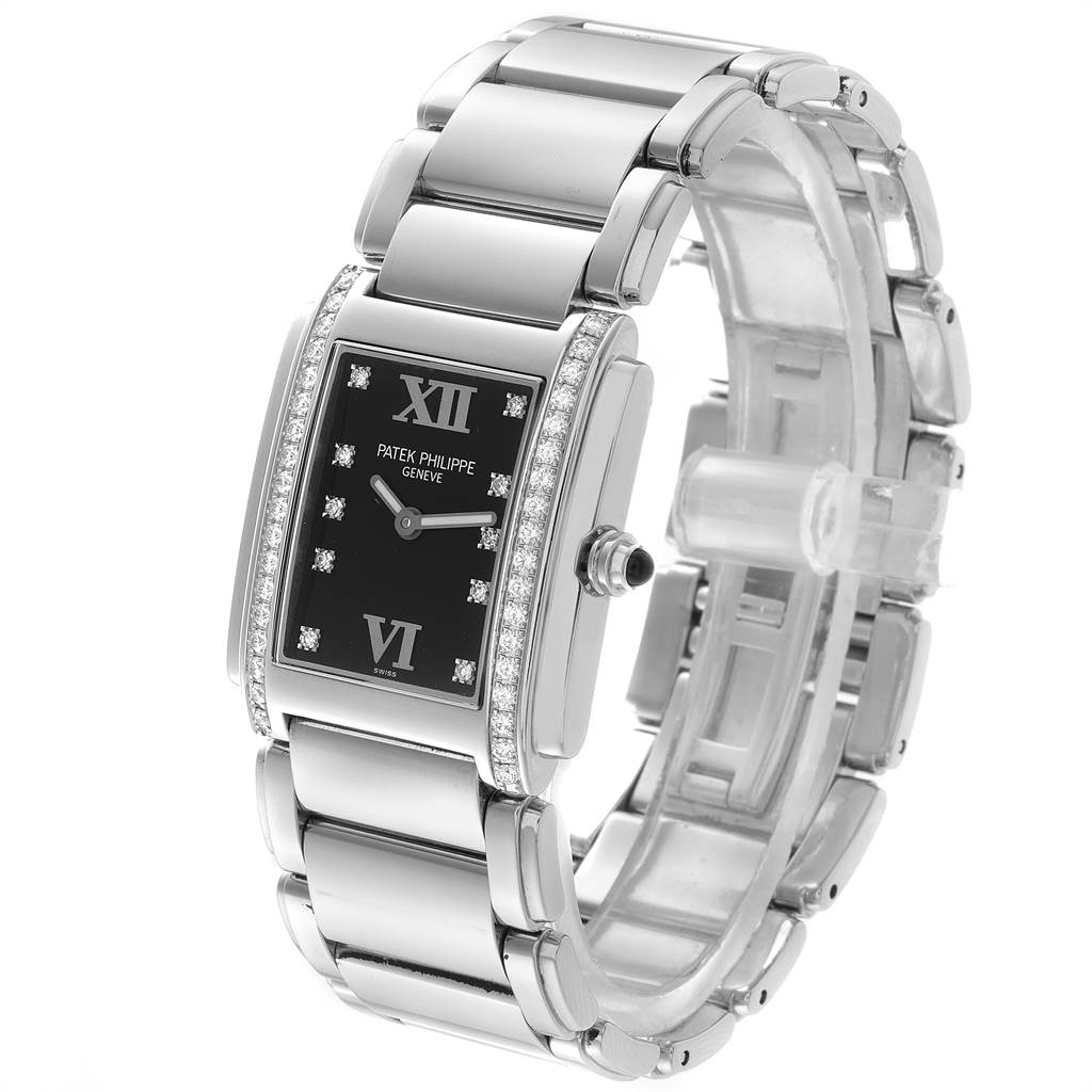 The image shows a front-side view of the Patek Philippe Twenty-4 4910-10A-001 Women's Stainless Steel Black Dial 4910-10A-001 Women's Stainless Steel Black Dial watch, highlighting the rectangular dial, steel bracelet, and diamond accents.