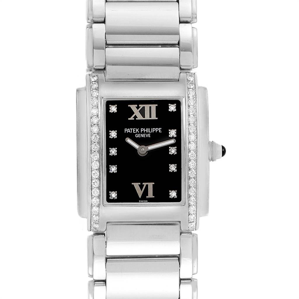 The image shows a front view of the Patek Philippe Twenty-4 4910-10A-001 Women's Stainless Steel Black Dial 4910-10A-001 Women's Stainless Steel Black Dial watch displaying the face, bracelet, and crown.