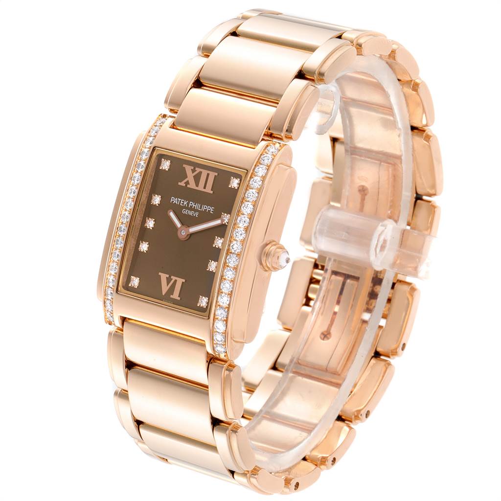 This Patek Philippe Twenty-4 4910/11R Women's Rose Gold Brown Dial 4910/11R Women's Rose Gold Brown Dial watch is shown at an angle displaying the band, case, dial, and diamond-encrusted bezel.