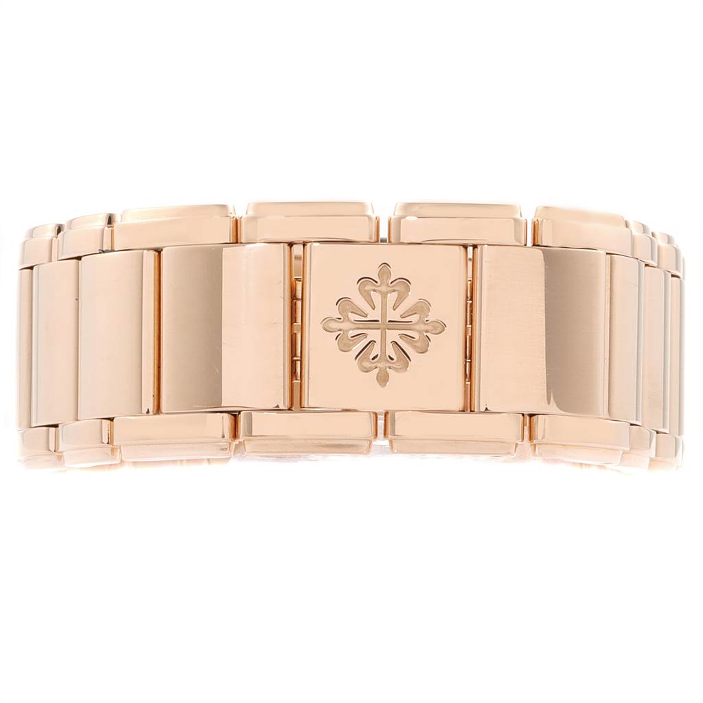 This image shows the gold link bracelet and clasp of a Patek Philippe Twenty-4 4910/11R Women's Rose Gold Brown Dial 4910/11R Women's Rose Gold Brown Dial model watch.