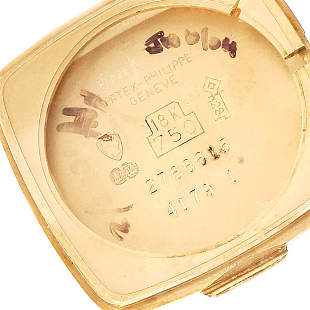 This image shows the interior case back of a Vintage Patek Philippe watch, including hallmarks and engraving details.