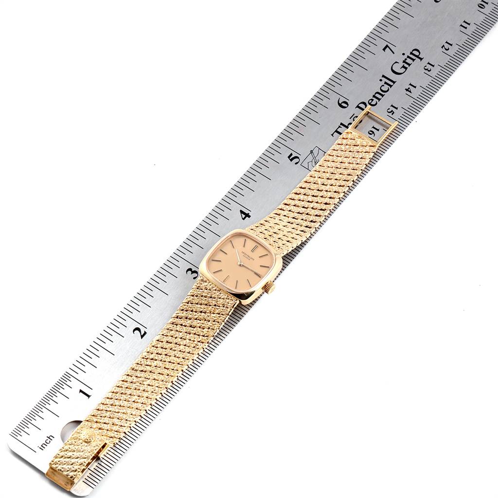 This image shows the front view of a Patek Philippe Vintage 4179 Women's Yellow Gold Champagne Dial 4179 Women's Yellow Gold Champagne Dial model watch placed on a ruler, displaying the dial and mesh strap.