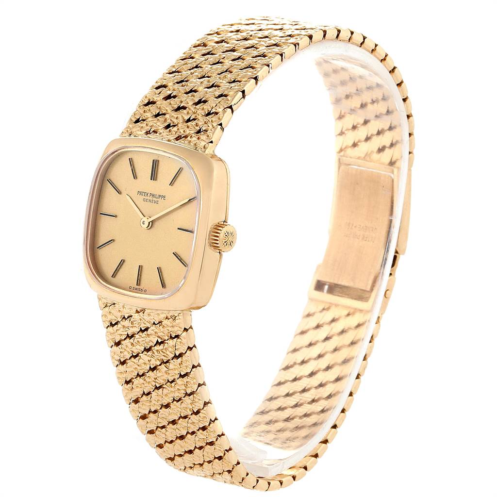 This is a side-angle view of the Patek Philippe Vintage 4179 Women's Yellow Gold Champagne Dial 4179 Women's Yellow Gold Champagne Dial model, showcasing the watch face, crown, and intricate gold bracelet.