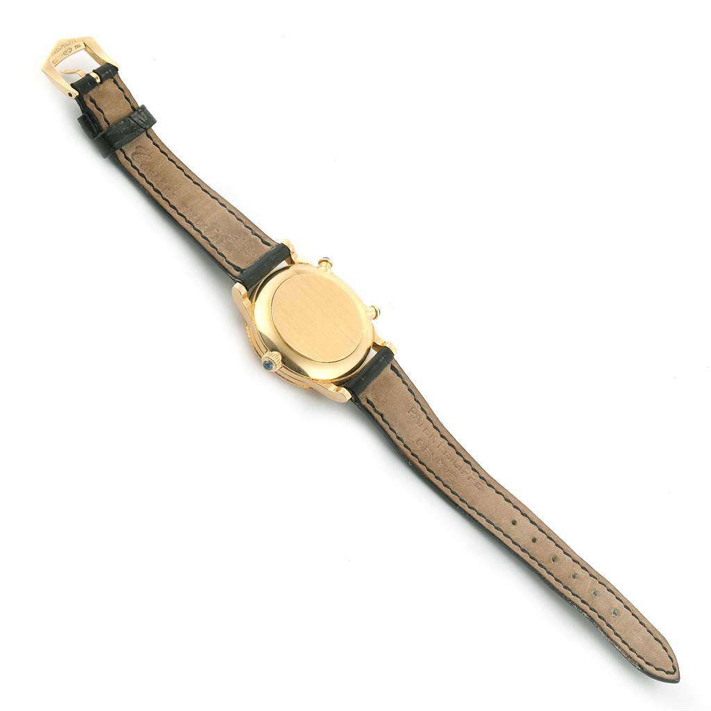 The image shows the back of the Patek Philippe Calatrava 4864J Women's Yellow Gold White Dial 4864J Women's Yellow Gold White Dial watch, showcasing the case back and leather strap.