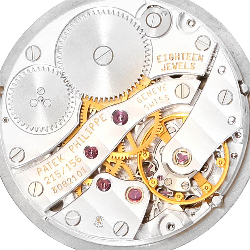 This image shows the intricate internal movement and gears of a Patek Philippe Calatrava 4864J Women's Yellow Gold White Dial 4864J Women's Yellow Gold White Dial watch, viewed from a top-down angle.