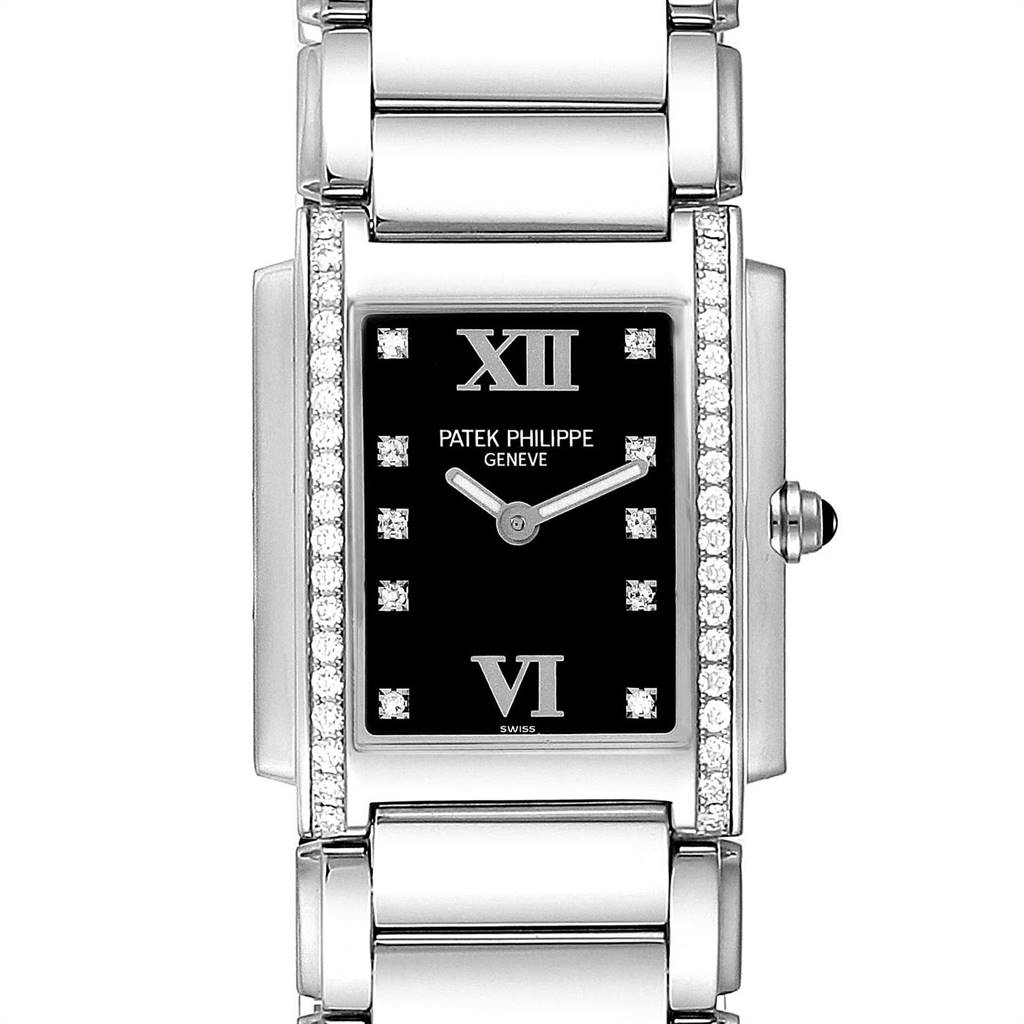 The image shows a front view of a Patek Philippe Twenty-4 4910-10A-001 Women's Stainless Steel Black Dial 4910-10A-001 Women's Stainless Steel Black Dial watch, highlighting the black dial, diamond accents, and metal bracelet.