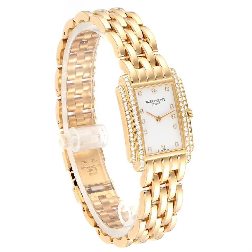 This image shows a side-angled view of the Patek Philippe Gondolo PATEK PHILIPPE Women's Yellow Gold White Dial PATEK PHILIPPE Women's Yellow Gold White Dial watch, highlighting its gold band and diamond-encrusted rectangular face.